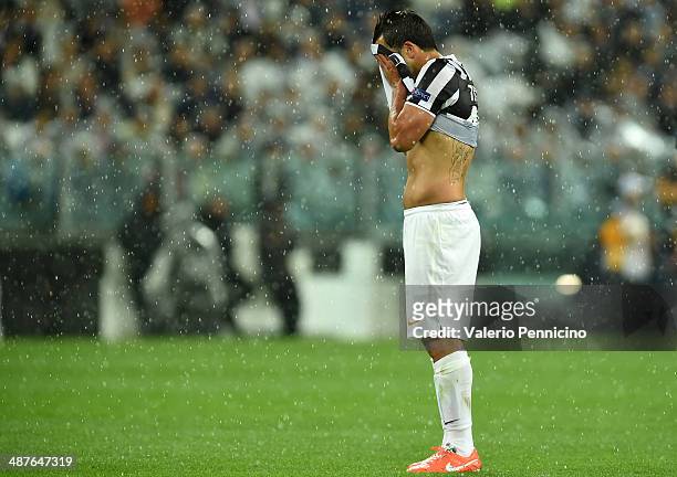 Carlos Tevez of Juventus show their dejection during the UEFA Europa League semi final match between Juventus and SL Benfica at Juventus Arena on May...