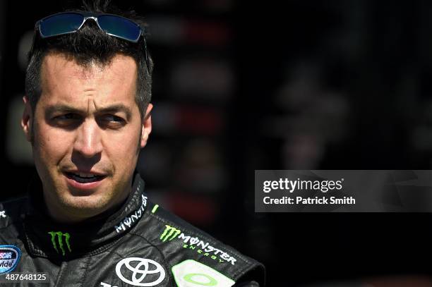 Sam Hornish Jr., driver of the Monster Energy Toyota, stands in the garage area during practice for the NASCAR Nationwide Series Aaron's 312 at...