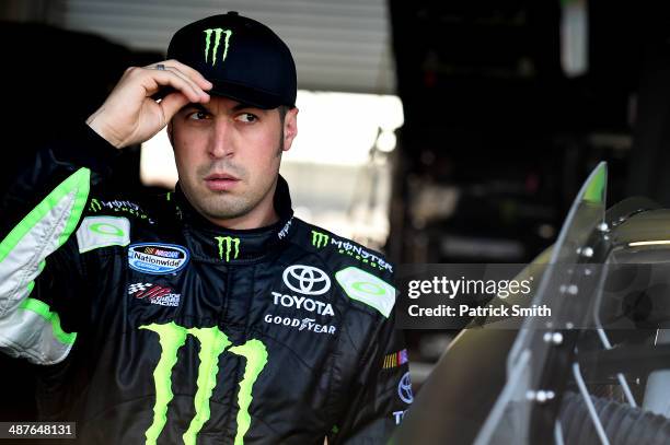 Sam Hornish Jr., driver of the Monster Energy Toyota, stands in the garage area during practice for the NASCAR Nationwide Series Aaron's 312 at...