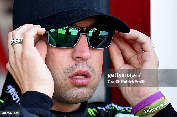 Sam Hornish Jr., driver of the Monster Energy Toyota, stands in the garage area during practice for the NASCAR Nationwide Series Aaron's 312 at...