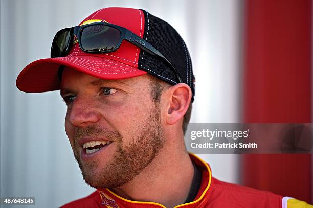 Regan Smith, driver of the Ragu Chevrolet, stands in the garage area during practice for the NASCAR Nationwide Series Aaron's 312 at Talladega...