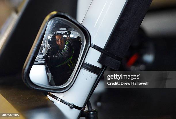 Sam Hornish Jr, driver of the Monster Energy Toyota, sits in his car during practice for the NASCAR Nationwide Series Aaron's 312 at Talladega...