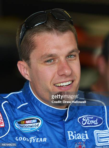 David Ragan, driver of the Carroll Shelby Engine Co Ford, stands in the garage area during practice for the NASCAR Nationwide Series Aaron's 312 at...