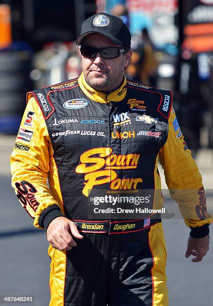 Brendan Gaughan, driver of the South Point Chevrolet, walks to the garage during practice for the NASCAR Nationwide Series Aaron's 312 at Talladega...