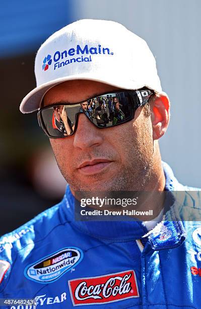 Elliott Sadler, driver of the OneMain Financial Toyota, stands in the garage area during practice for the NASCAR Nationwide Series Aaron's 312 at...