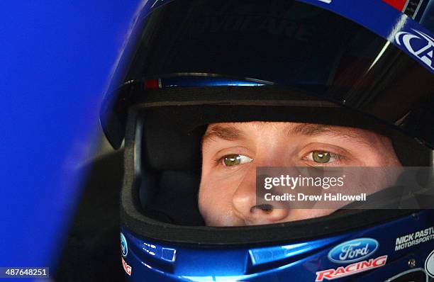 Trevor Bayne, driver of the AdvoCare Ford, sits in his car during practice for the NASCAR Nationwide Series Aaron's 312 at Talladega Superspeedway on...