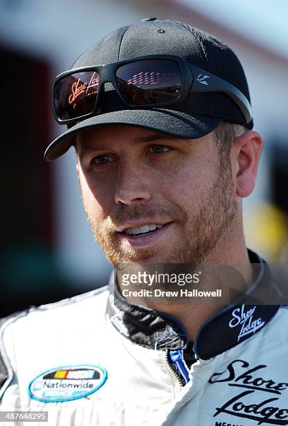 Brian Scott, driver of the Shore Lodge Chevrolet, stands in the garage area during practice for the NASCAR Nationwide Series Aaron's 312 at Talladega...