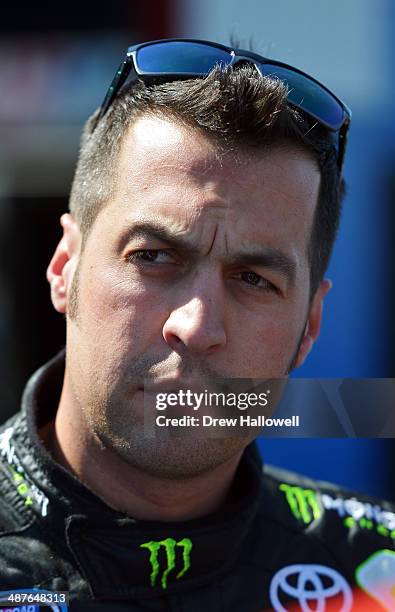 Sam Hornish Jr, driver of the Monster Energy Toyota, stands in the garage area during practice for the NASCAR Nationwide Series Aaron's 312 at...