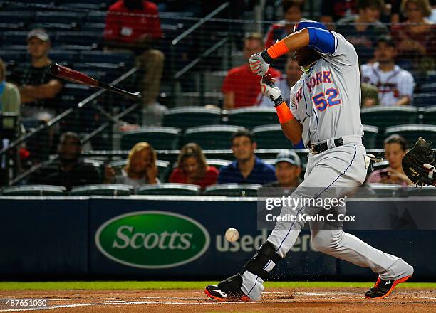 Yoenis Cespedes of the New York Mets loses his bat as he grounds out softly against the Atlanta Braves in the first inning at Turner Field on...