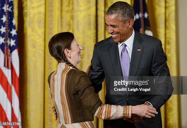 President Barack Obama presents Meredith Monk with the 2014 National Medal of Arts at The White House on September 10, 2015 in Washington, DC.