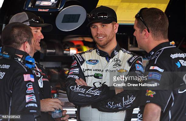 Brian Scott, driver of the Shore Lodge Chevrolet, stands in the garage area during practice for the NASCAR Nationwide Series Aaron's 312 at Talladega...