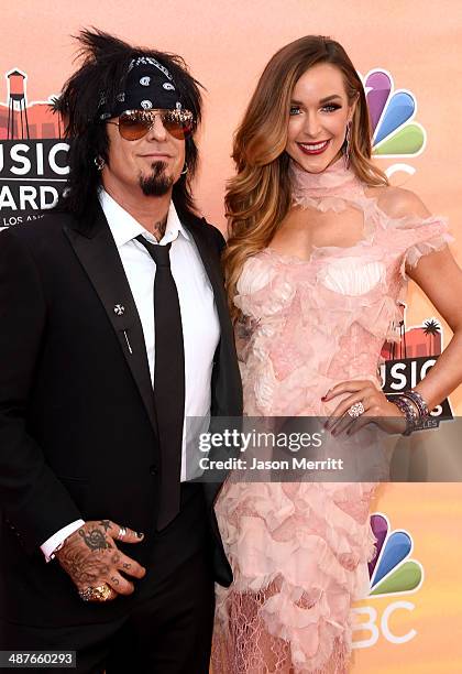 Musician Nikki Sixx and Courtney Sixx attend the 2014 iHeartRadio Music Awards held at The Shrine Auditorium on May 1, 2014 in Los Angeles,...