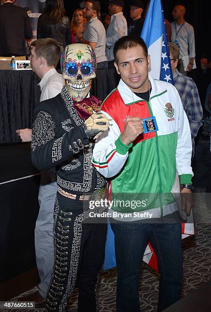 Boxer Marco Periban and a fan dressed as Death pose after the undercard final press conference at the MGM Grand Hotel/Casino on May 1, 2014 in Las...