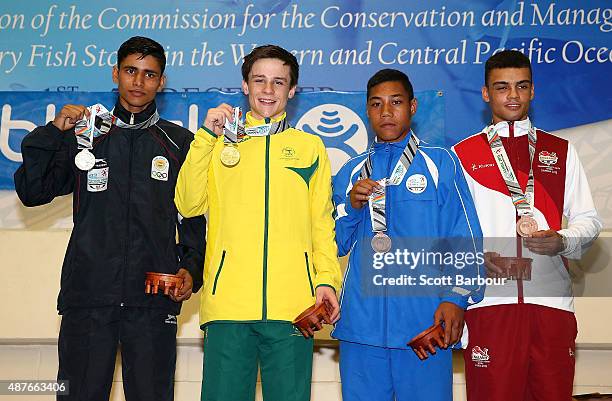 Jack Bowen of Australia, Gaurav Solanki of India, Ioane Ioane of Samoa and Brandon Daord of England pose with their medals during the medal ceremony...