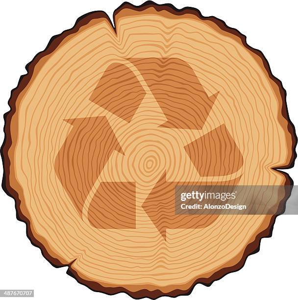 wooden cross section with recycling symbol - tree rings stock illustrations