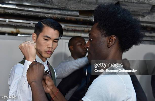 Designer Afriyie Poku prepares as AXE and Esquire present the AXE White Label Collective during the opening night of New York Fashion Week on...