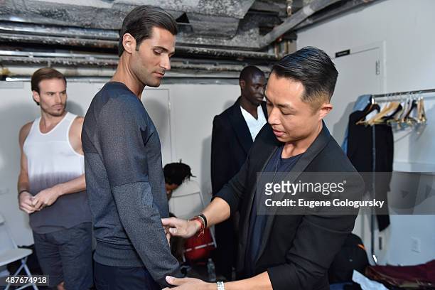 Designer Stanley Cheung prepares backstage as AXE and Esquire present the AXE White Label Collective during the opening night of New York Fashion...