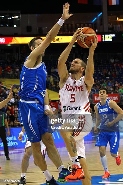 Sinan Guler of Turkey vies for the ball during the FIBA EuroBasket 2015 Group B basketball match between Turkey vs Iceland at Mercedes Benz Arena in...