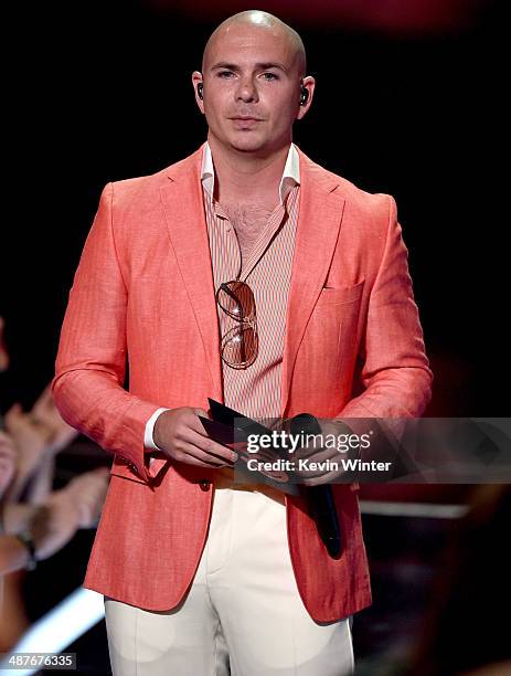 Rapper/host Pitbull accepts the Hip Hop/R&B Song of the Year for 'Pour It Up' by Rihanna onstage during the 2014 iHeartRadio Music Awards held at The...