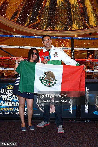 Boxer Marco Periban poses with a fan holding the Mexican flag after the undercard final press conference at the MGM Grand Hotel/Casino on May 1, 2014...