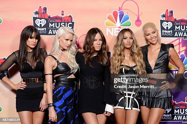 Natasha Slayton, Lauren Bennett, Emmalyn Estrada, Paula Van Oppen of G.R.L and choreographer Robin Antin of the Pussycat Dolls pose in the press room...