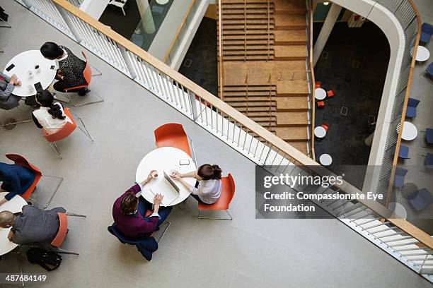 business people having meeting in cafe - casual woman business stock pictures, royalty-free photos & images