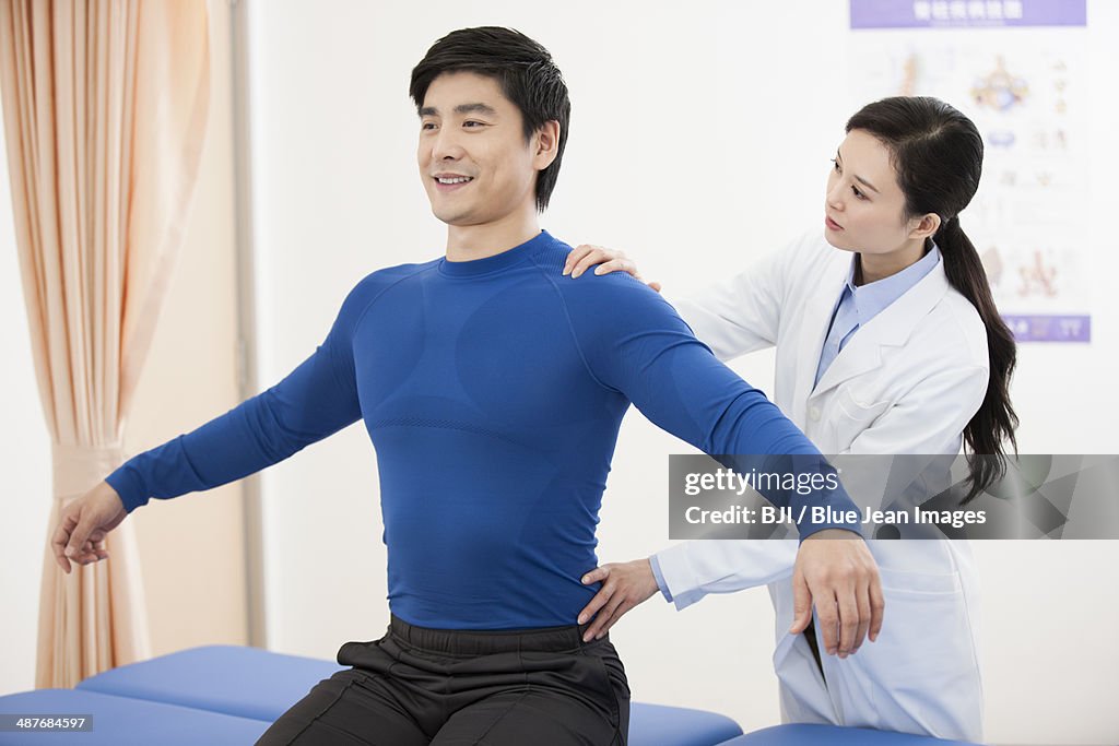 Female doctor examining patient