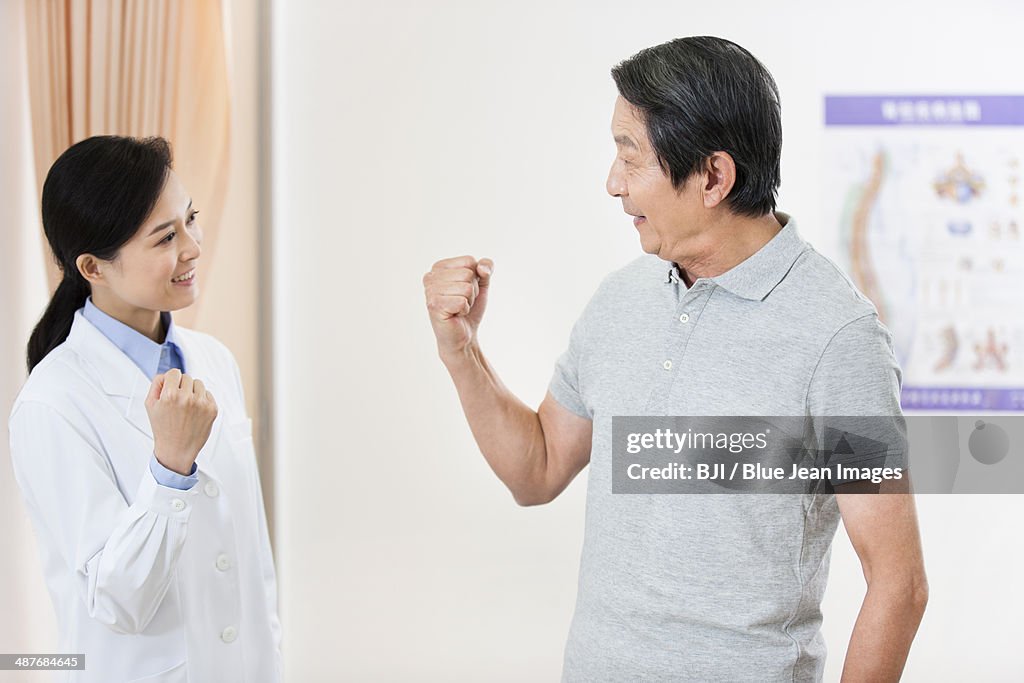 Cheerful female doctor and senior patient