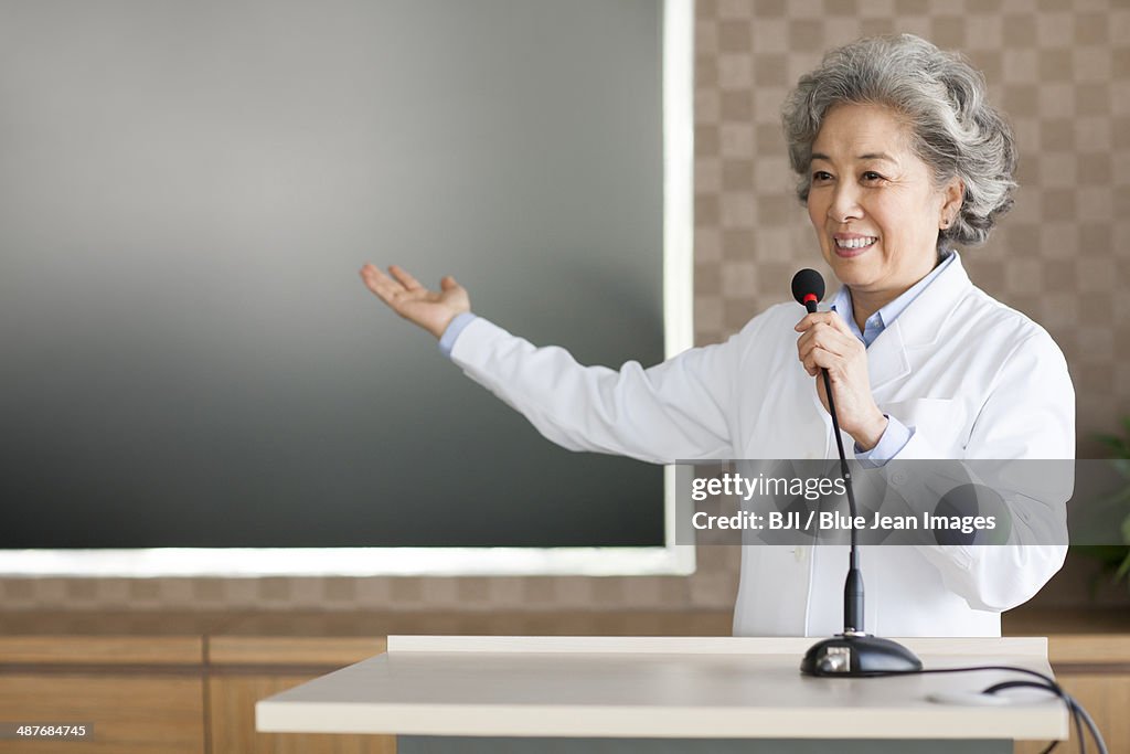 Senior female doctor giving a speech