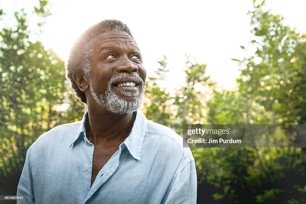 Senior man smiling outdoors