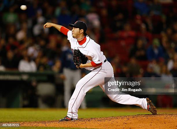 Junichi Tazawa of the Boston Red Sox throws in relief in the seventh inning against the Tampa Bay Rays in game two of a doubleheader at Fenway Park...