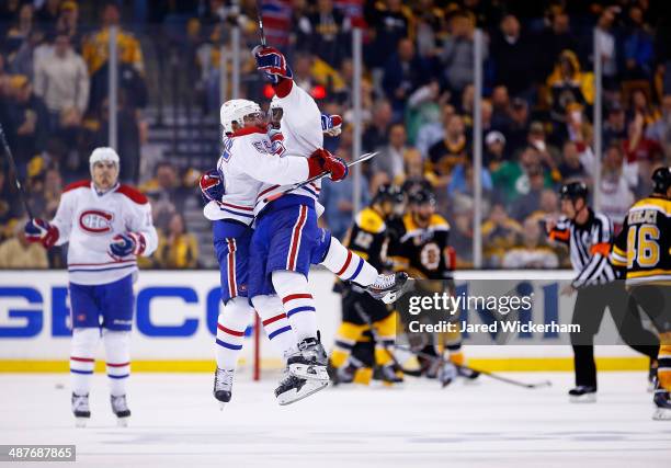 Francis Bouillon of the Montreal Canadiens celebrates his goal in the third period with teammate P.K. Subban against the Boston Bruins in Game One of...