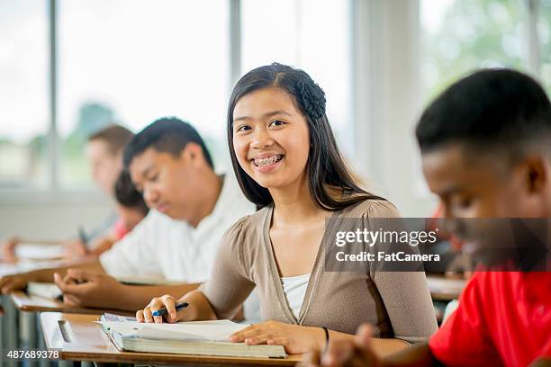 high schoolers in class - teenager reading a book stock pictures, royalty-free photos & images