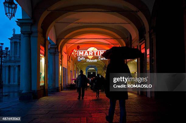 piazza san carlo arcade with neon signs, turin italy - turin arcades stock pictures, royalty-free photos & images