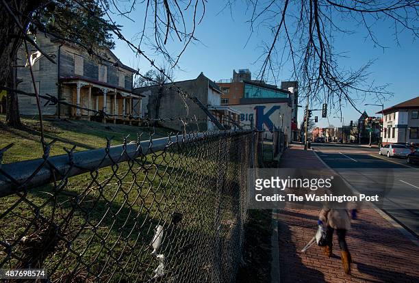 Pedestrian passes decaying homes in the 2200 block of Martin Luther King Avenue in Washington, DC on January 17, 2014. The parcel, better known as...