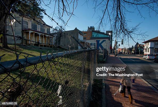 Pedestrian passes decaying homes in the 2200 block of Martin Luther King Avenue in Washington, DC on January 17, 2014. The parcel, better known as...