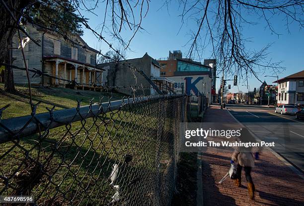 Pedestrian passes decaying homes in the 2200 block of Martin Luther King Avenue in Washington, DC on January 17, 2014. The parcel, better known as...