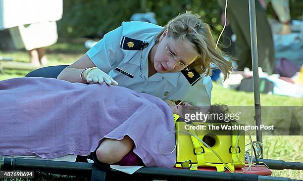 Air Force Lt. Colonel Janet Deltuva helps comfort a woman hurt from the terrorist attack at the Pentagon in Arlington, VA on September 11, 2001.