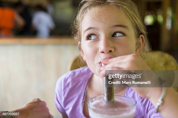 caucasian girl drinking smoothie at breakfast - milk shake stock pictures, royalty-free photos & images