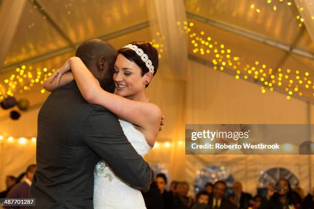 newlywed couple dancing at reception - ehe gleichberechtigung stock-fotos und bilder