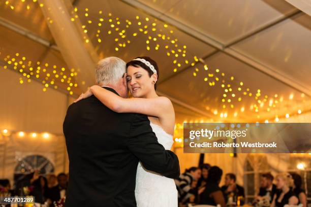 bride dancing with father at reception - daughter wedding stock pictures, royalty-free photos & images