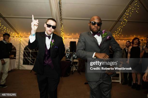 groom and groomsman dancing at reception - african american wedding foto e immagini stock