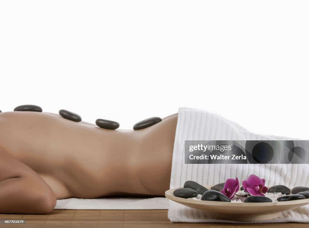 Caucasian woman enjoying hot stone massage