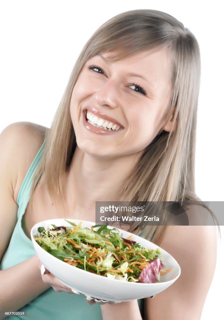 Hispanic woman eating salad