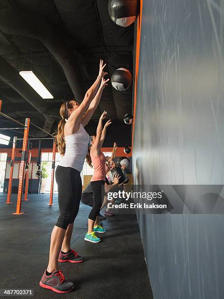 people training together in gym - medicine ball stock pictures, royalty-free photos & images