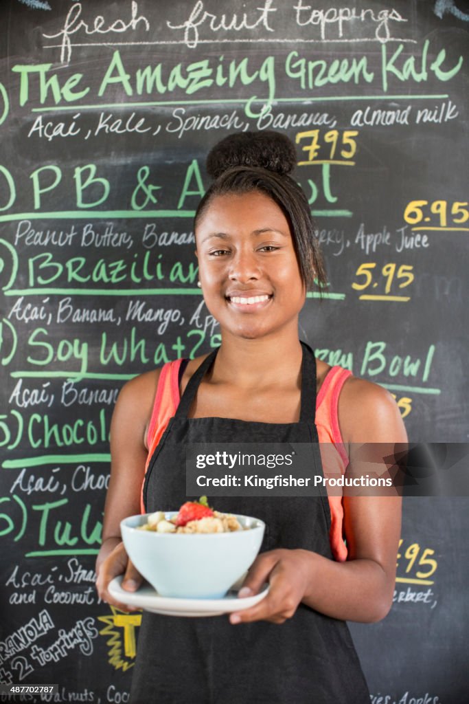 Black teenage girl working in cafe