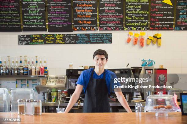 mixed race teenage boy working in cafe - youth worker stock pictures, royalty-free photos & images