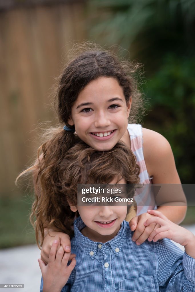 Mixed race children smiling together