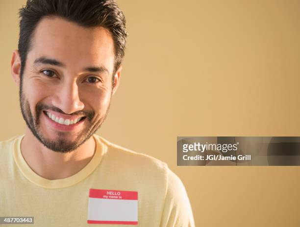 mixed race man wearing name tag - name tag bildbanksfoton och bilder
