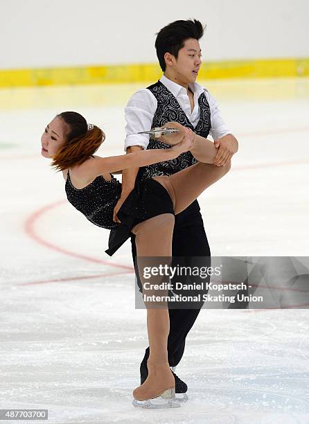 Ye Ri Kim and Alex Kang Chan Kam of Korea skate during junior pairs short programm of ISU Junior Grand Prix of figure skating on September 11, 2015...